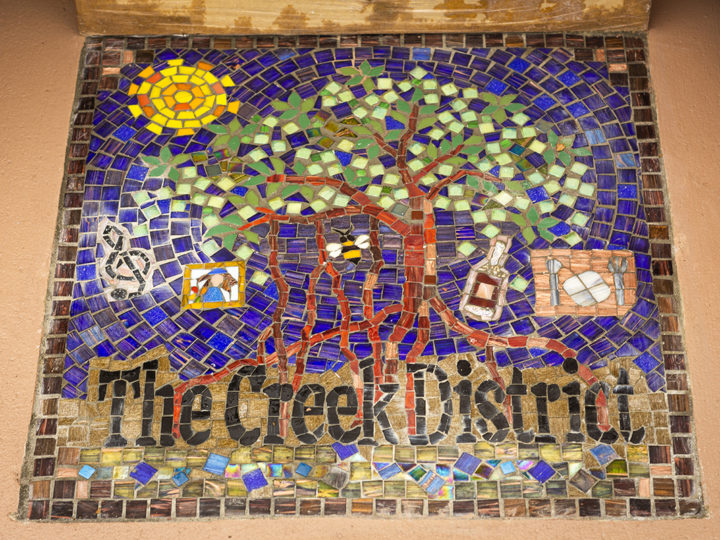 the very first Creek District sidewalk mosaic